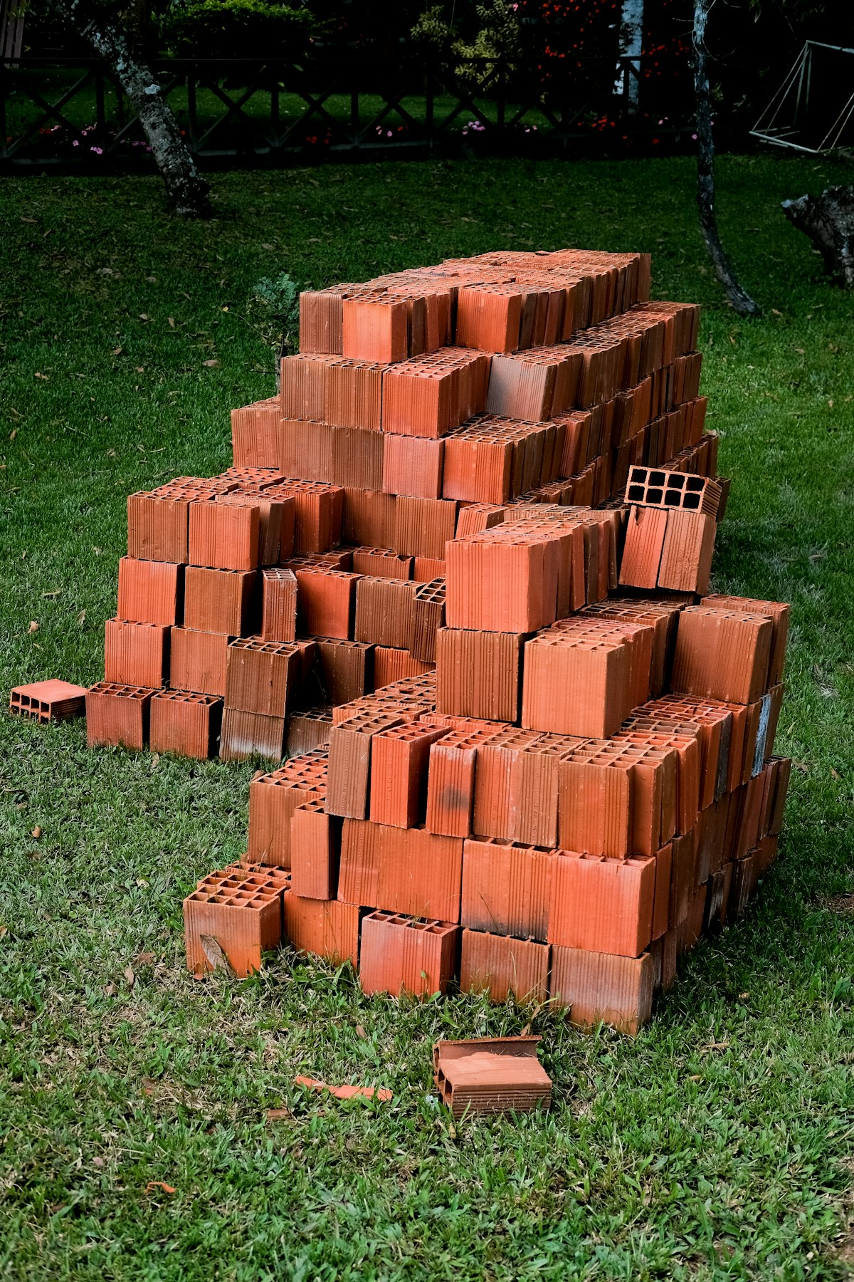Stacked clay bricks ready for delivery to site